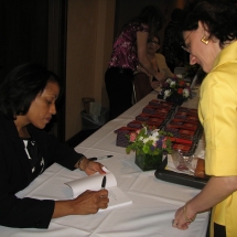 Sarita Maybin signing a book for a fan